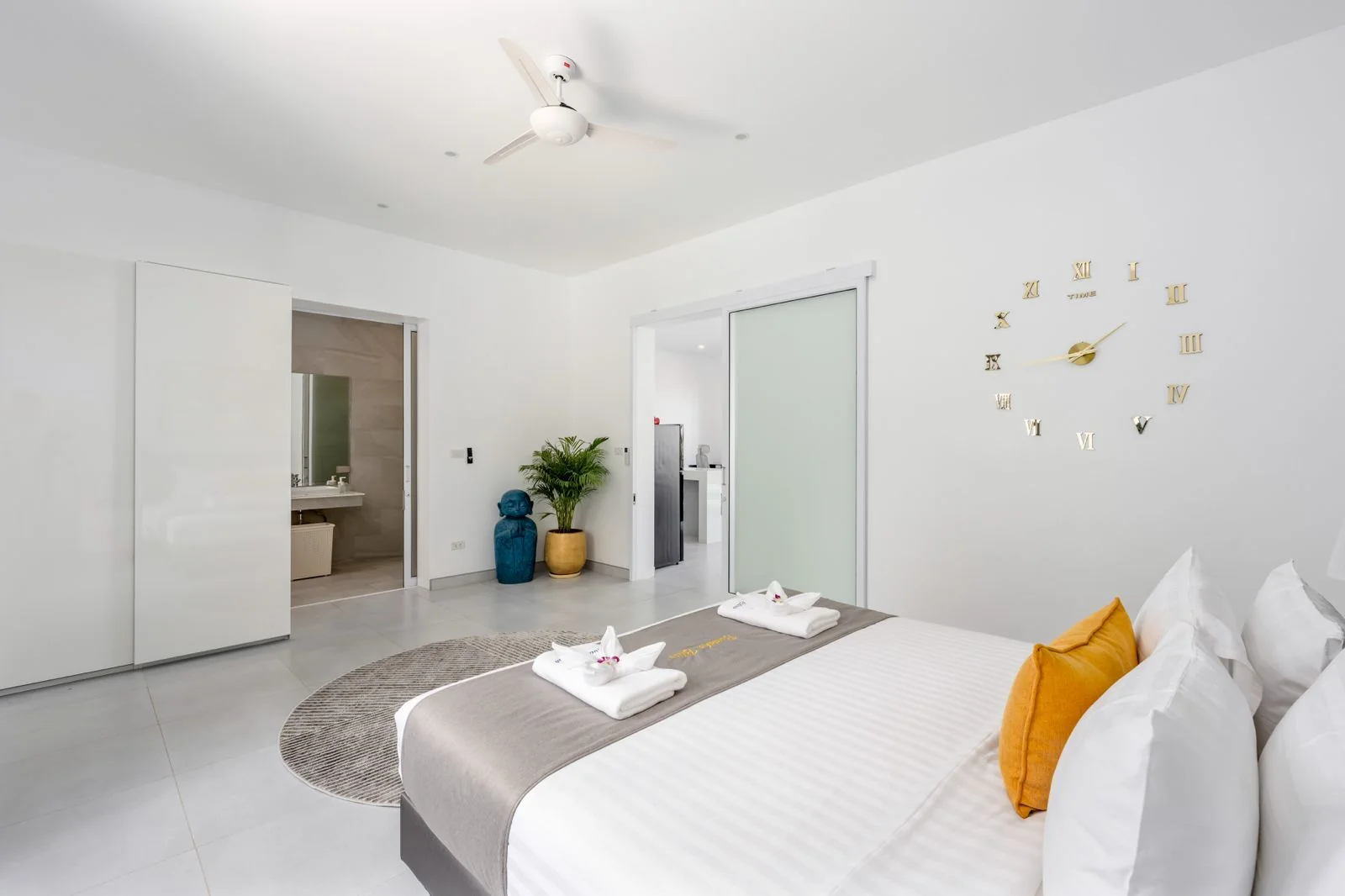 Calm white bedroom with warm accent details